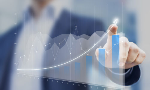 Financial charts showing growing revenue on touch screen Financial charts showing growing revenue on touch screen