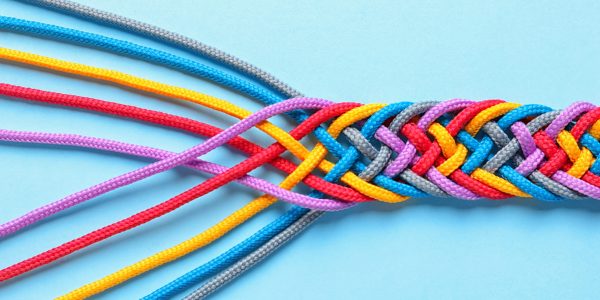 Braided ropes on color background, top view. Unity concept